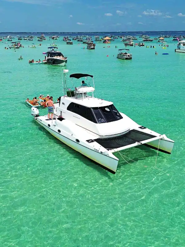Beautiful white yacht anchored at Crab Island, Florida's popular boating destination.