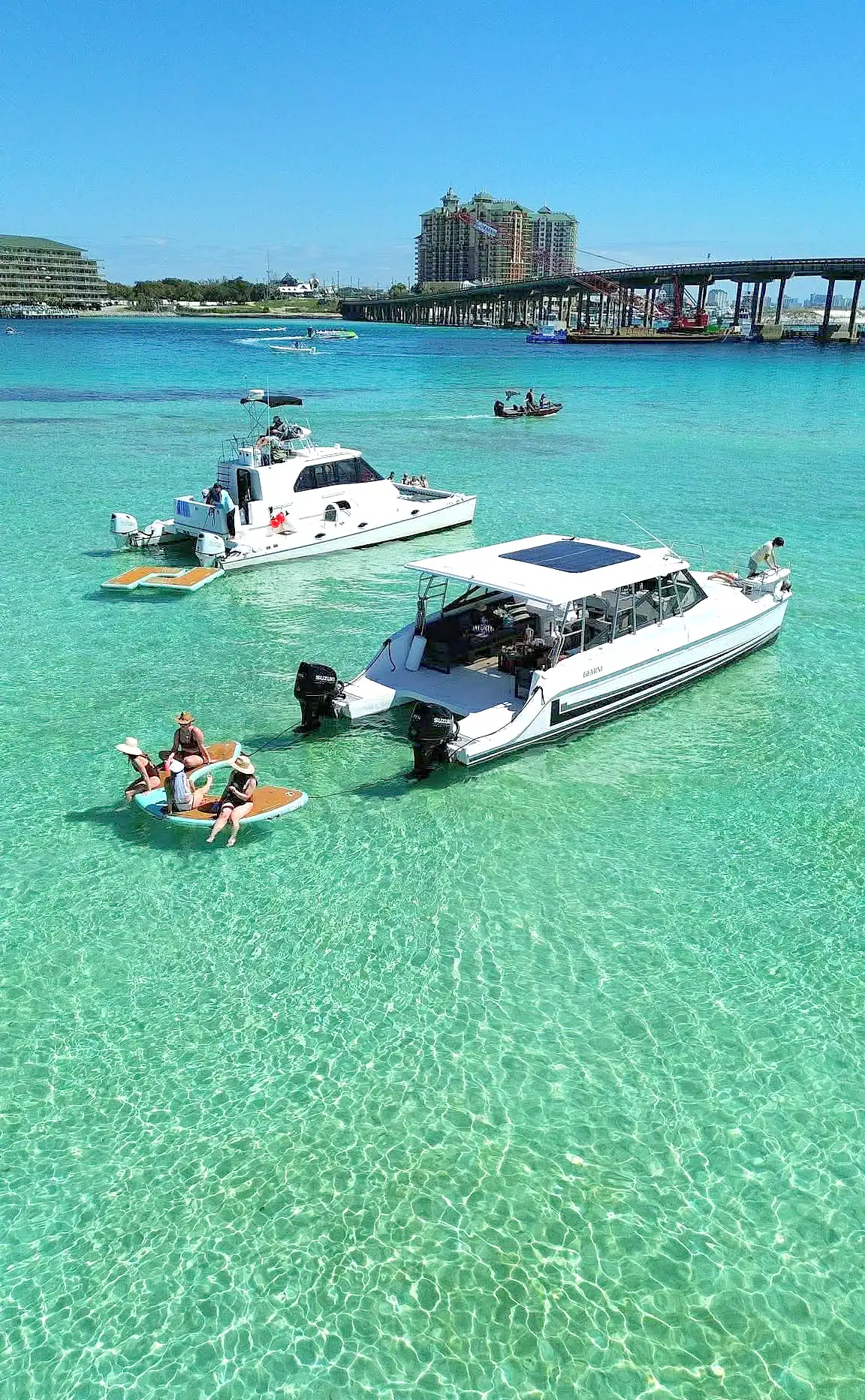 Luxury boats at Crab Island, clear turquoise waters, Florida.