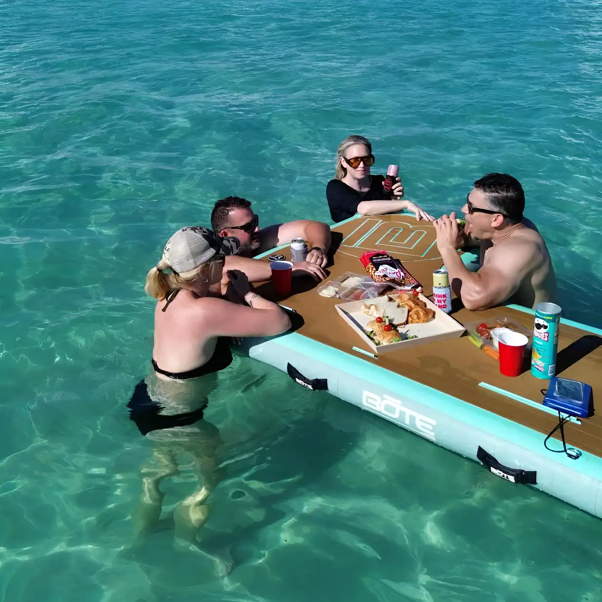 Friends having lunch around BOTE floats at Crab Island
