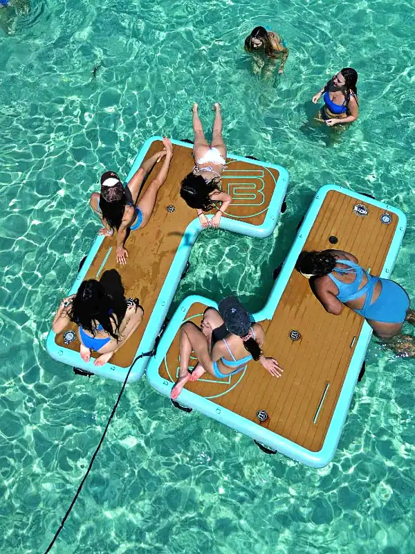 Bachelorettes playing and sitting on BOTE floats at Crab Island