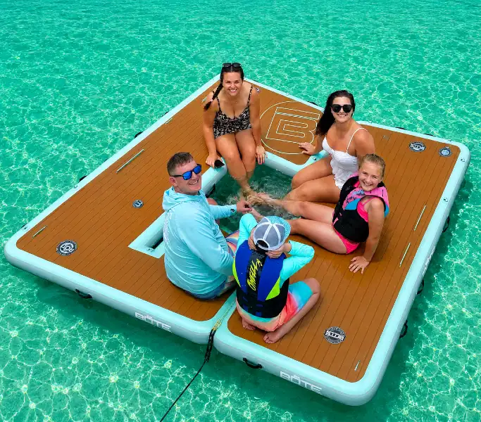 A family sitting on BOTE floats at Crab Island