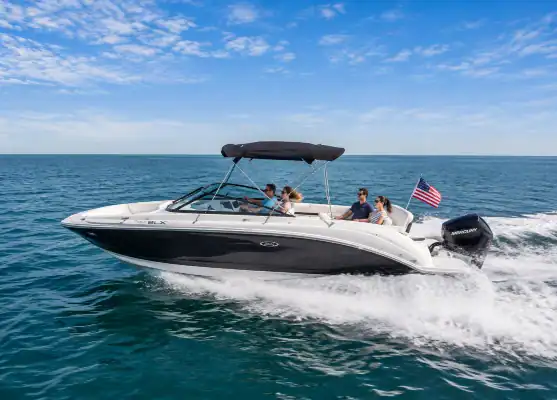 Sea Ray 290 Sport yacht racing across the water.